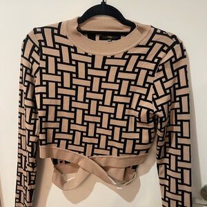 Beautiful cut out pattern sweater size M/L NWOT